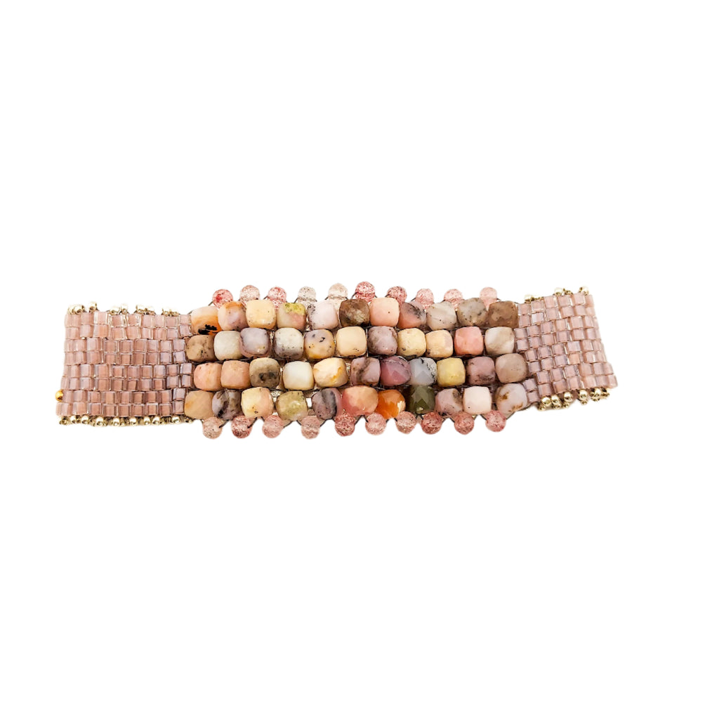 Beaded bracelet with multicolored stones on a white background