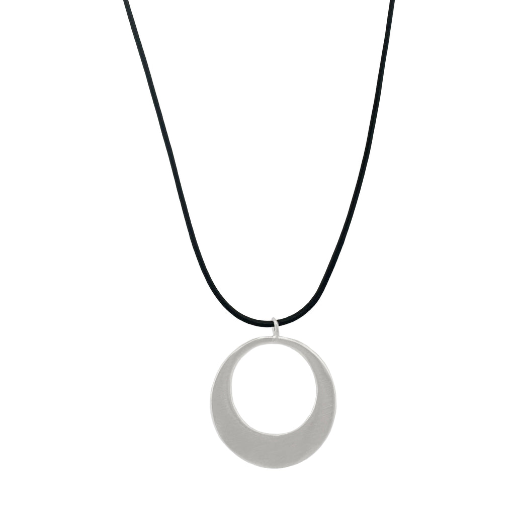 large circle on leather necklace in silver