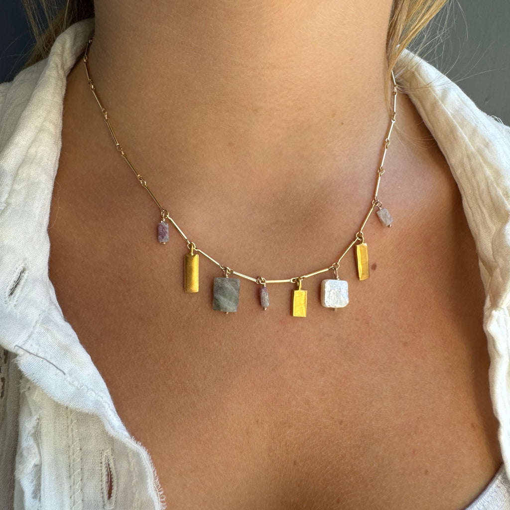 Necklace with stones on a person's neck