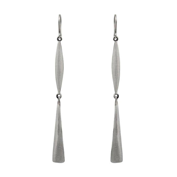 Pair of silver earrings on a light gray background