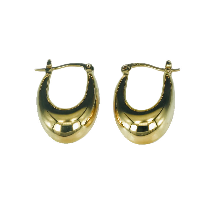 Gold hoop earrings on a white background