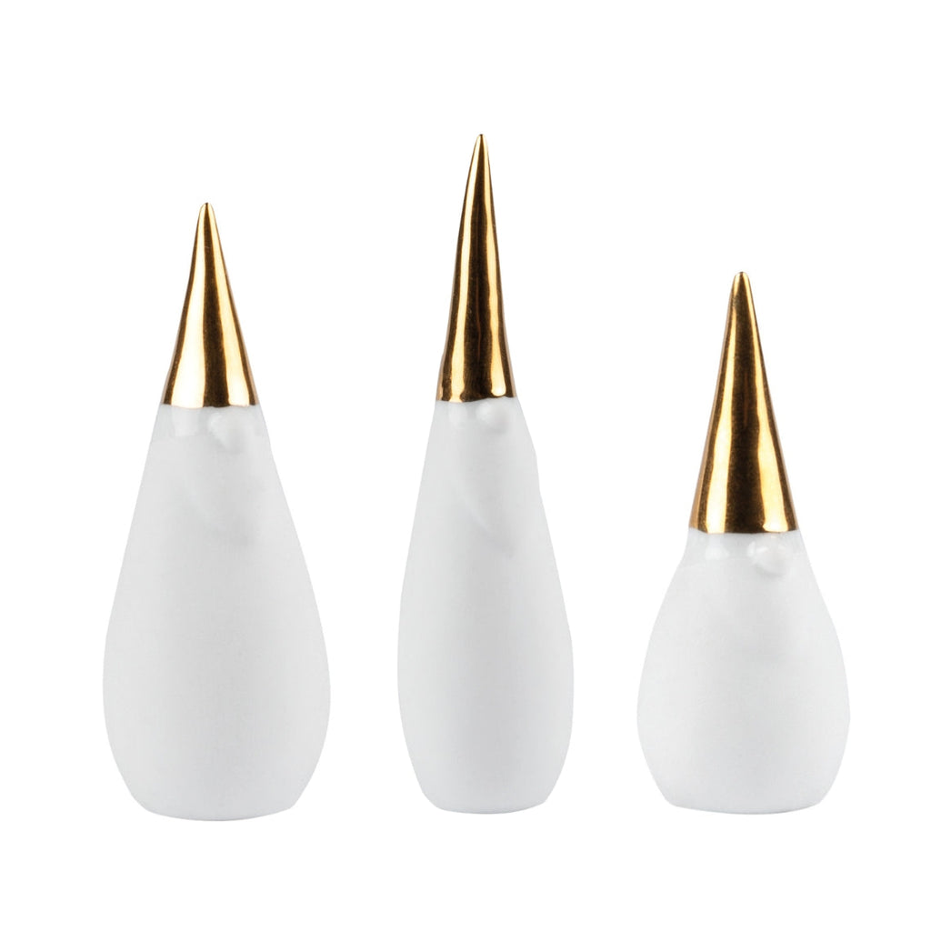 Three white santa gnomes with gold hats on white background