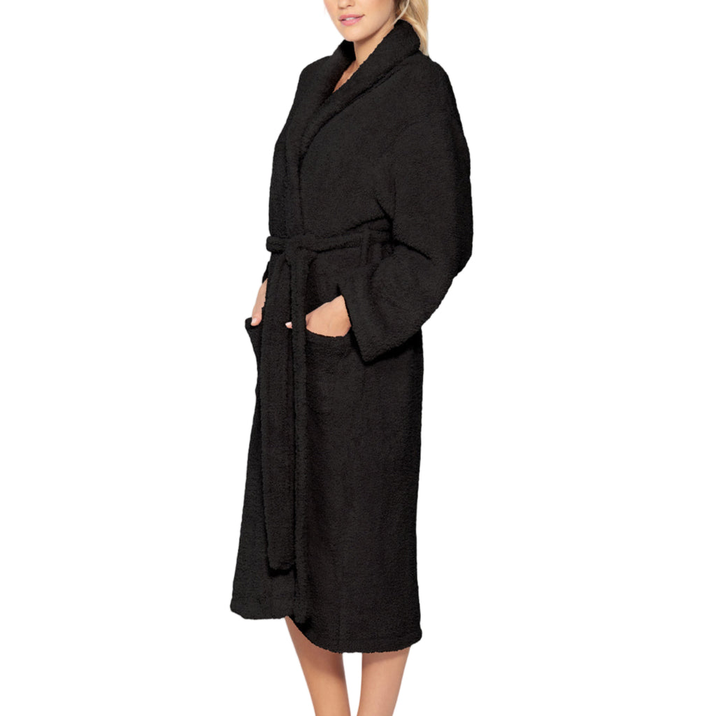 Woman wearing a black robe on a plain background
