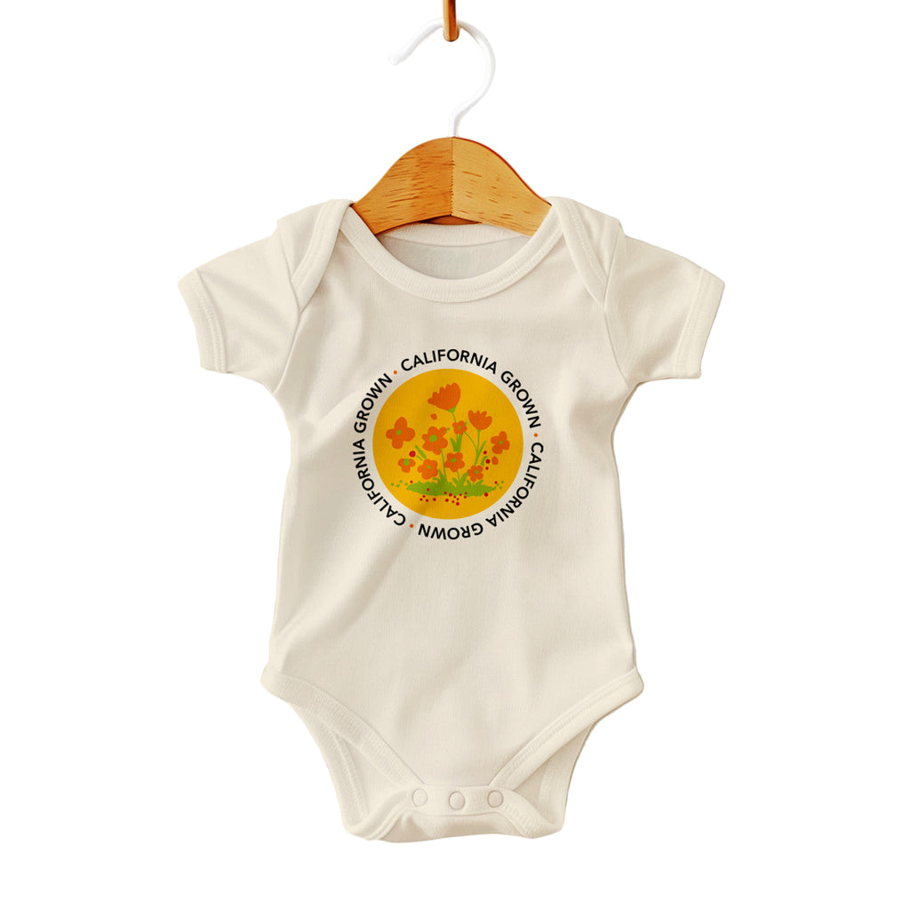 Baby onesie with a poppy design and 'California Grown' text on a white background