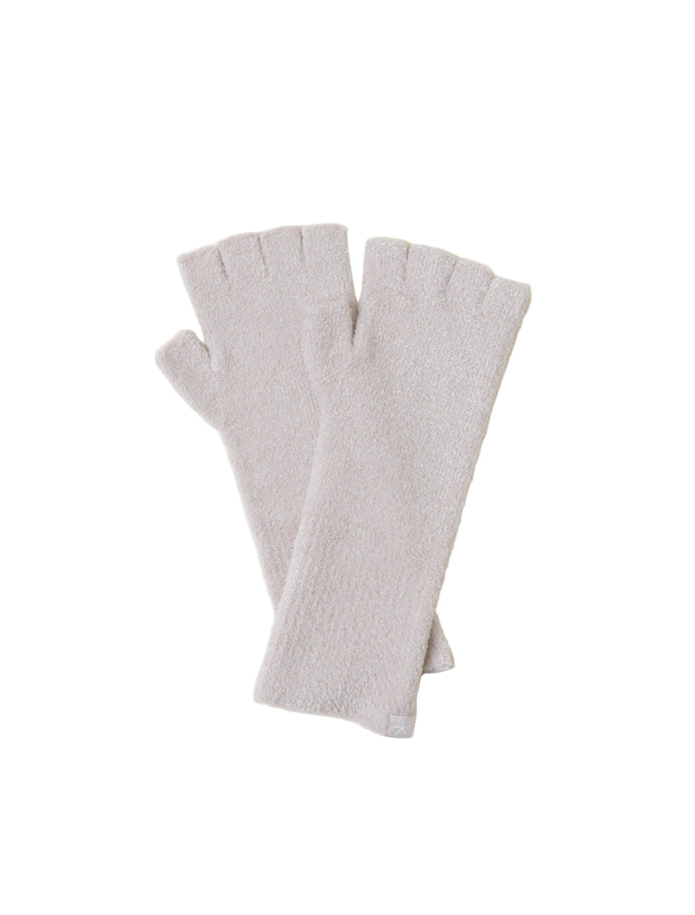 Pair of cream fingerless gloves on a light gray background