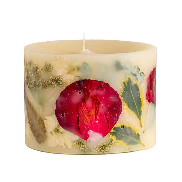 Decorative candle with floral design on a white background