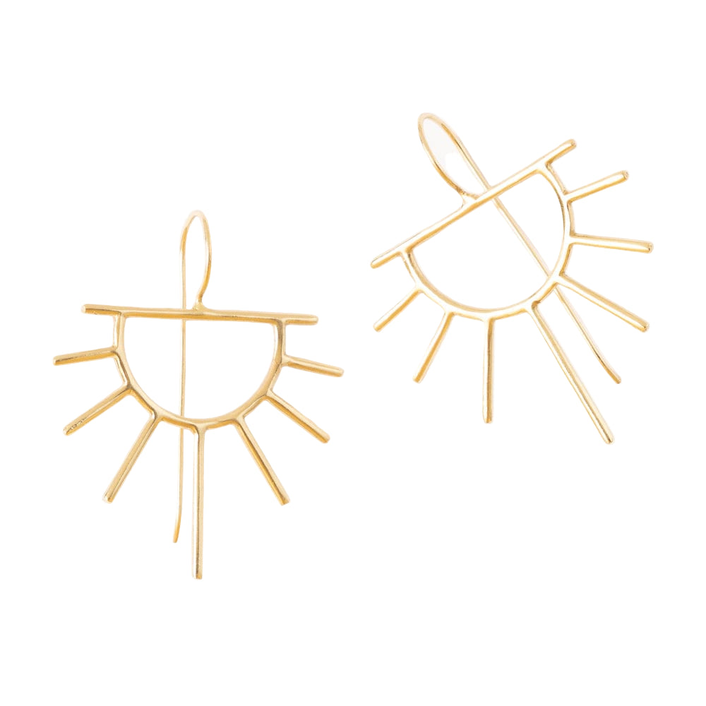 Gold sun-shaped earrings on a white background