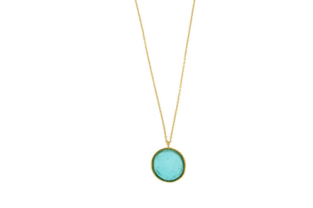 Necklace with a teal pendant on a white background