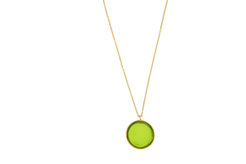 Necklace with a green pendant on a white background