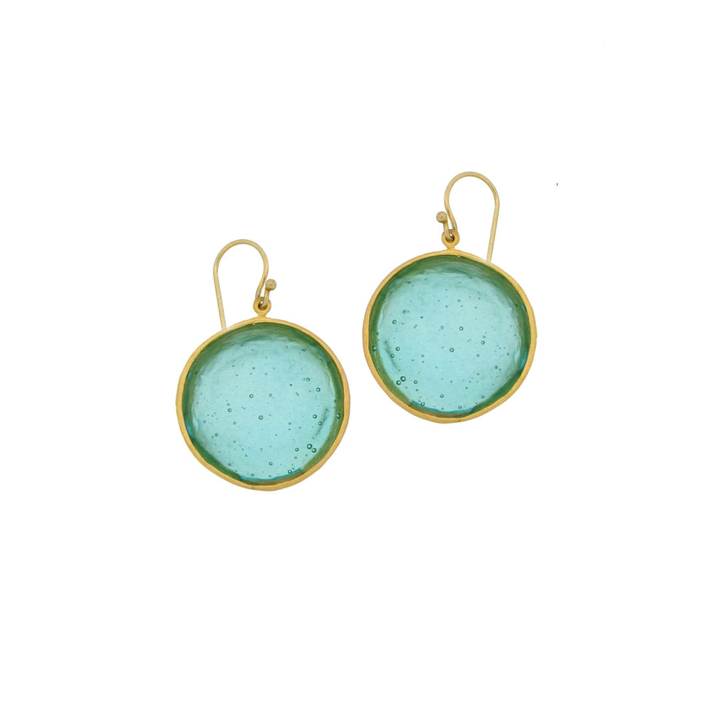 A pair of teal-colored glass earrings with bronze wires