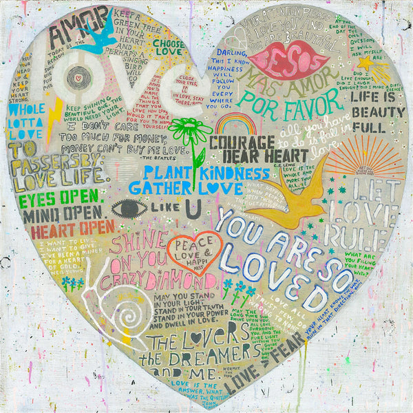 Colorful heart-shaped collage with various phrases and symbols on a textured white background