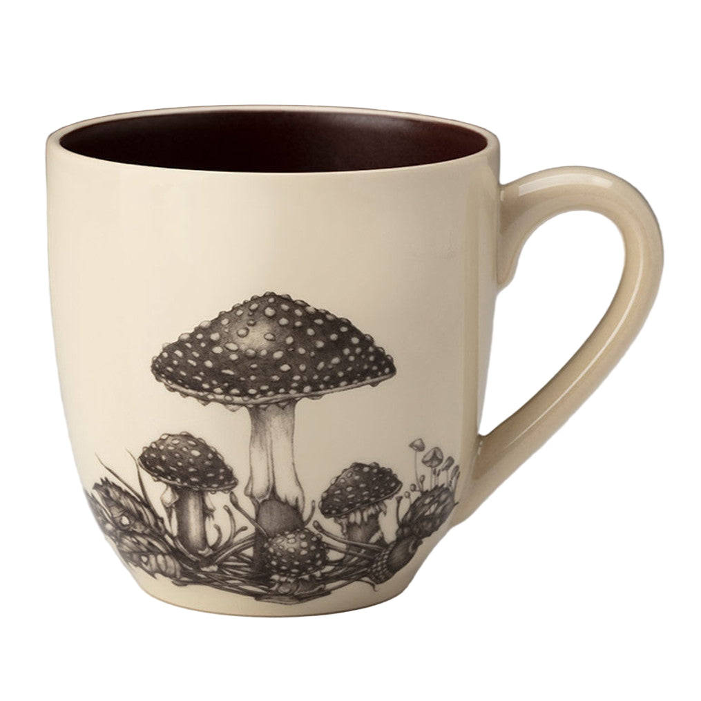 Ceramic mug with mushroom design on a neutral background