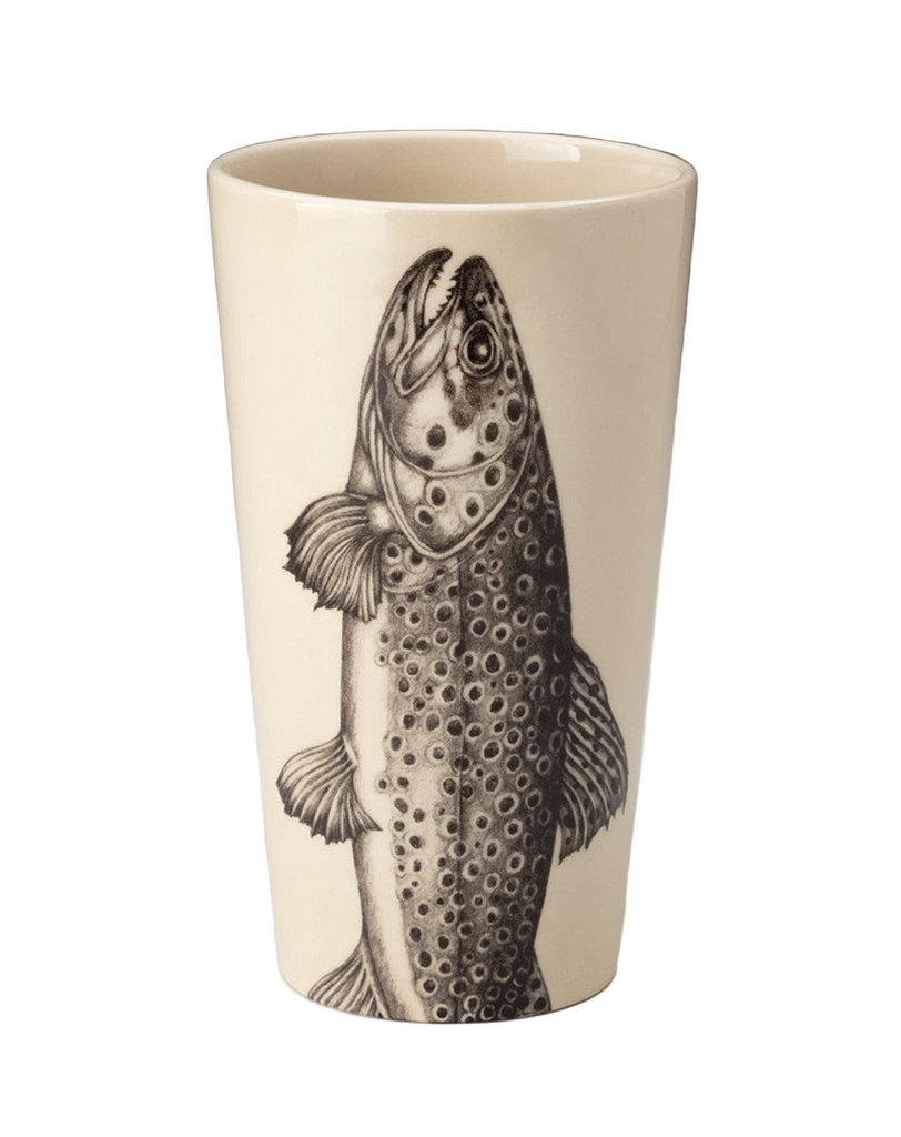 Ceramic tumbler with a fish design on a plain background