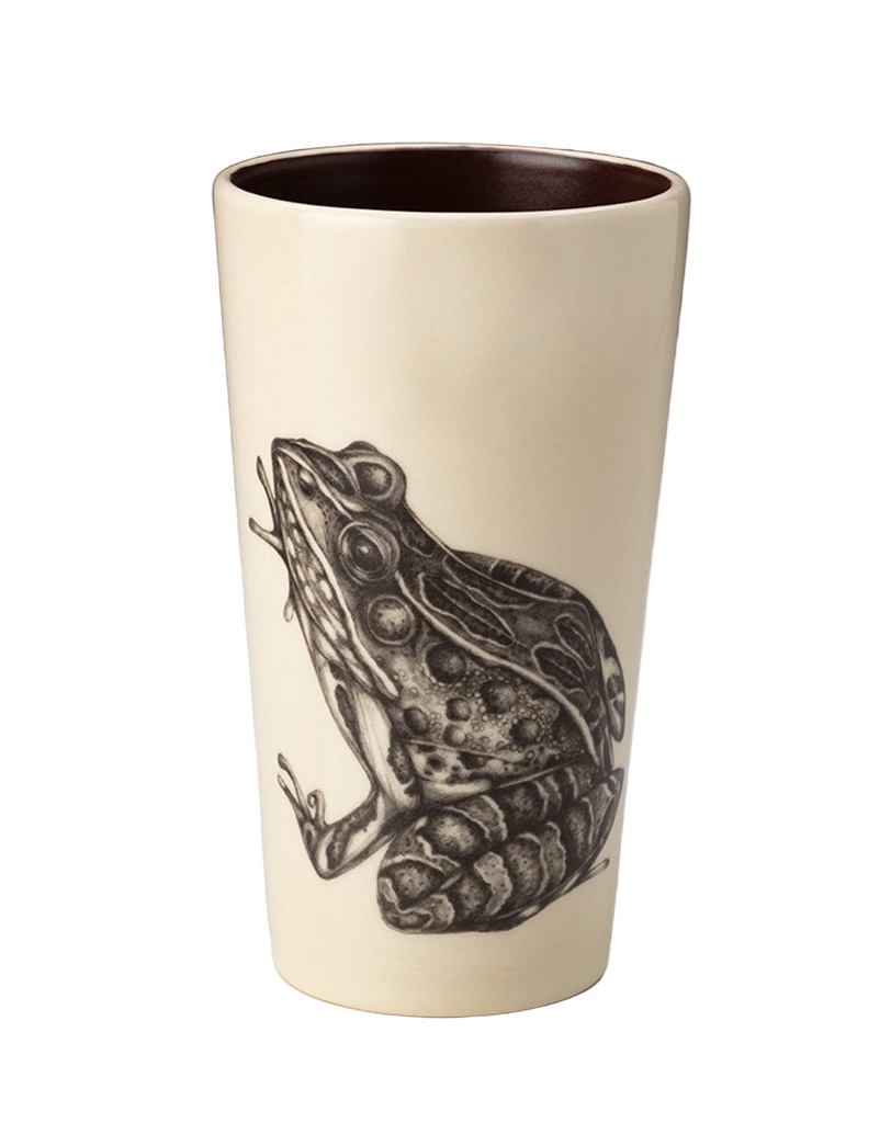Ceramic tumbler with a black frog illustration on a white background