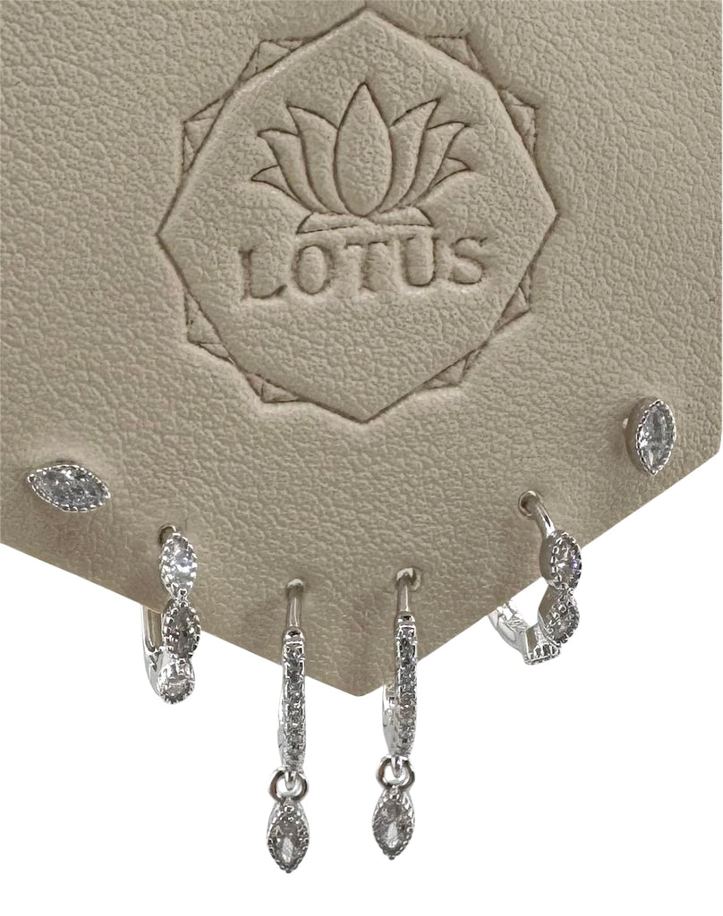 Three pairs of silver earrings with CZ accents on a branded Lotus display card