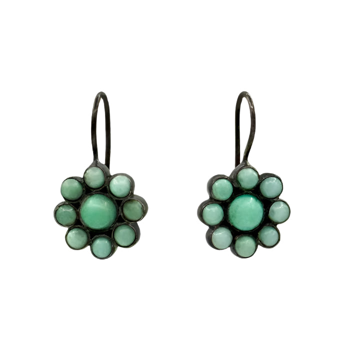 Pair of earrings with green - chrysophase stones in a floral design on a light gray background