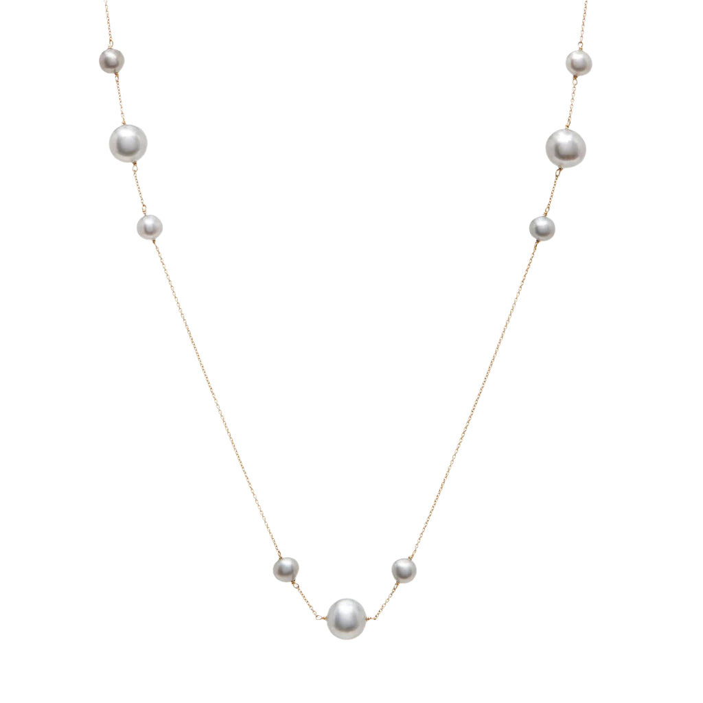 A necklace with a series of freshwater pearls graduated in size, suspended on a 14k gold chain.