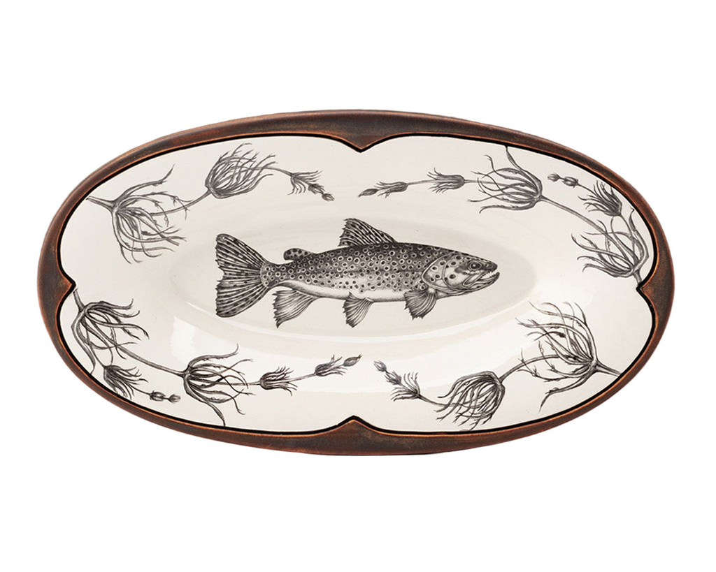 Decorative plate with a fish design on a white background