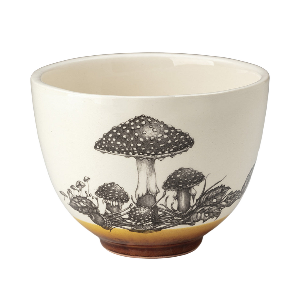 Ceramic bowl with mushroom design on a gradient background