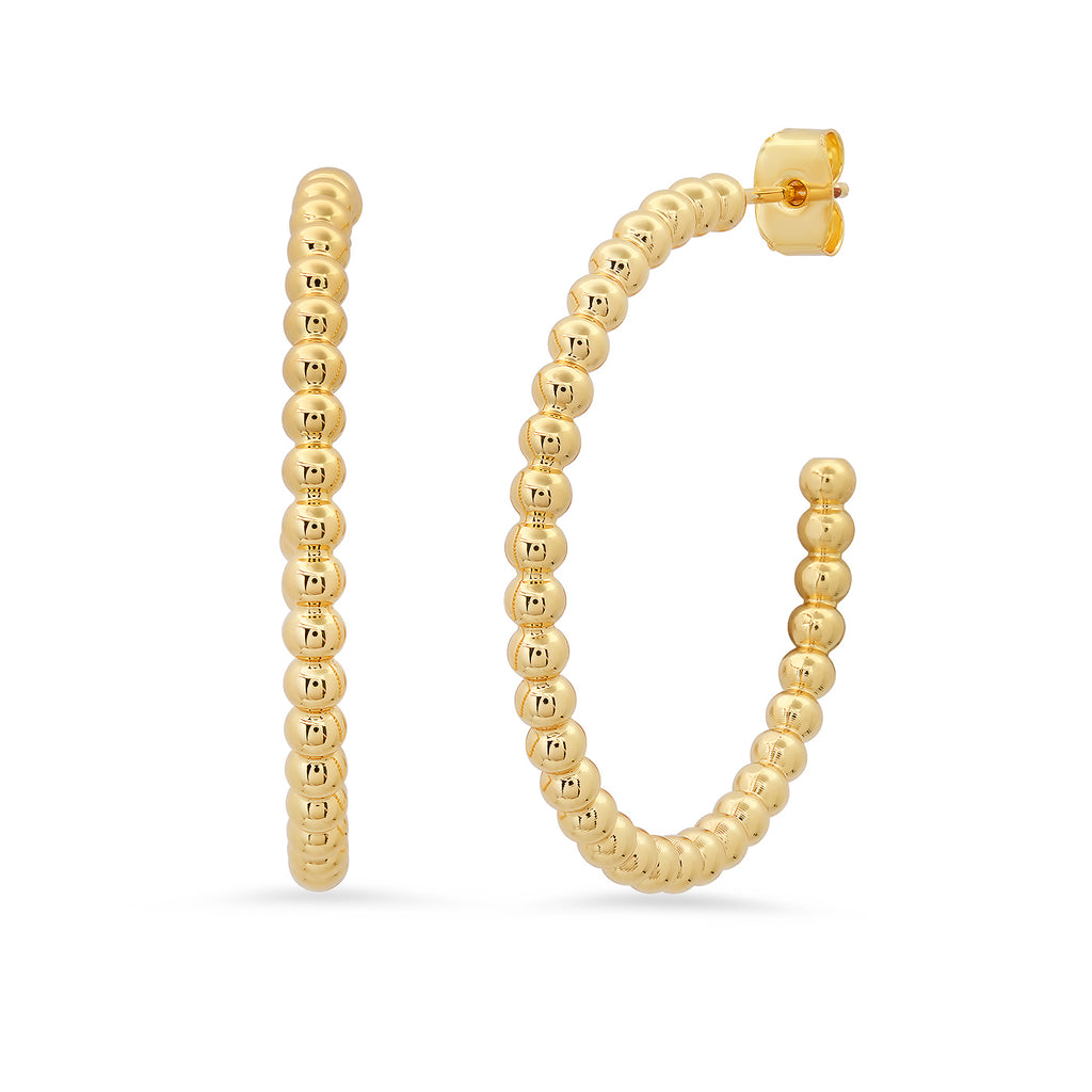 Gold hoop earrings with beaded design on a white background