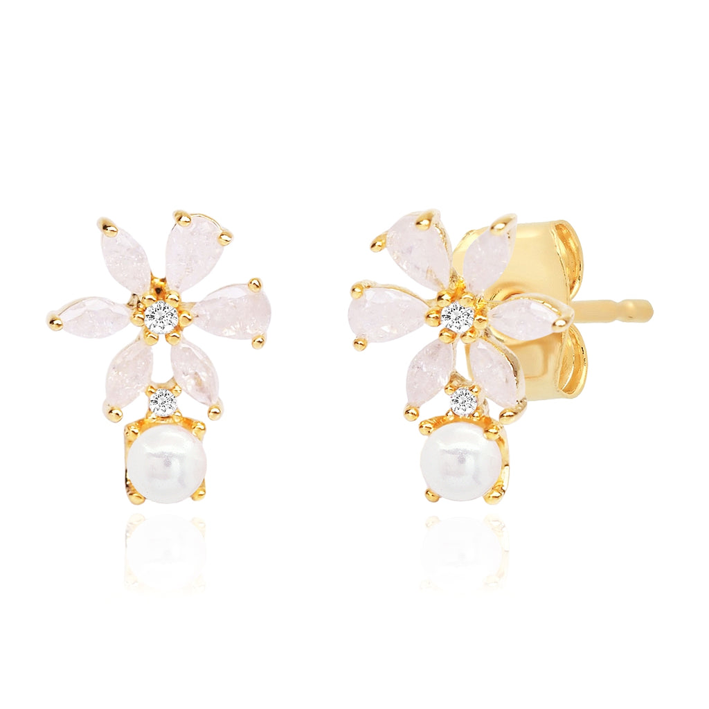 Gold earrings with pink stones and pearls on a white background