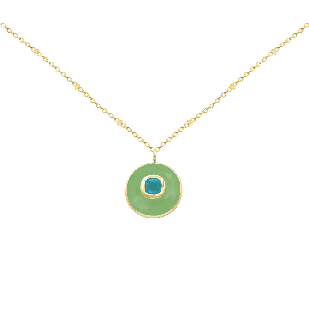 Gold necklace with a green pendant on a white background