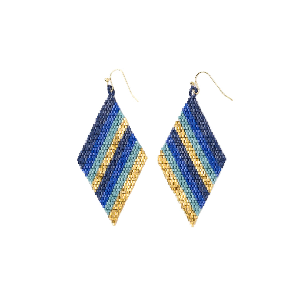 Pair of blue and gold beaded earrings on a white background
