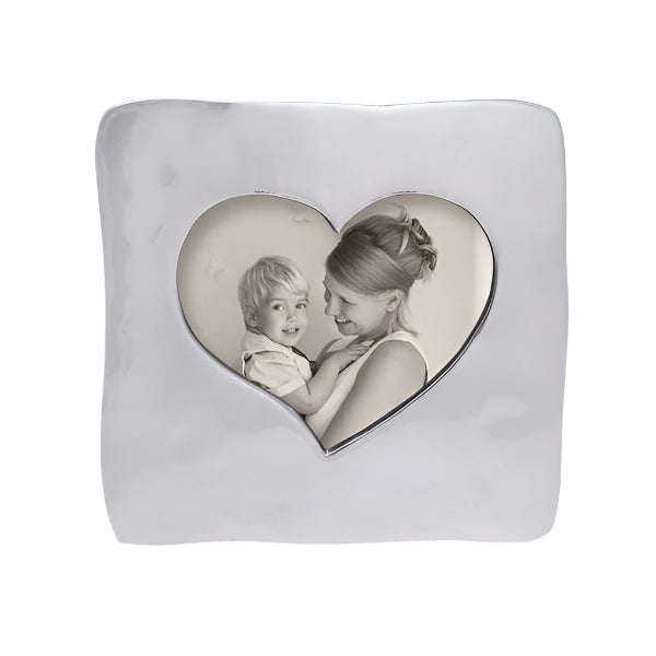 A square open heart frame with a photo of a woman and a child visible through the heart-shaped cutout.