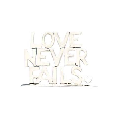 Love Never Fails Small Standing Word Plaque in silver on white background