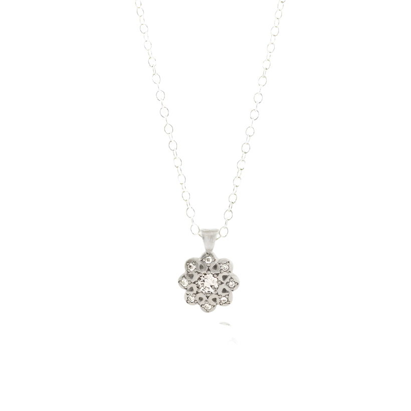 moonflower pendant on a silver chain front view over a white background