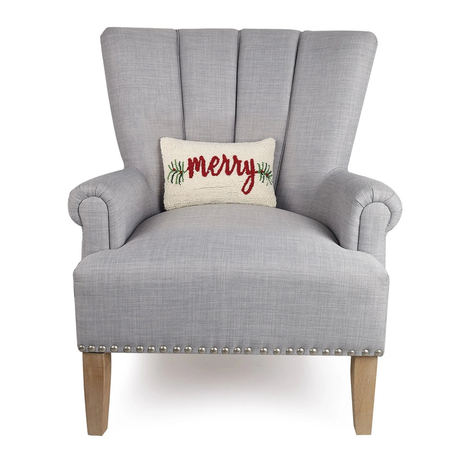 Gray armchair with a 'Merry' pillow on a white background