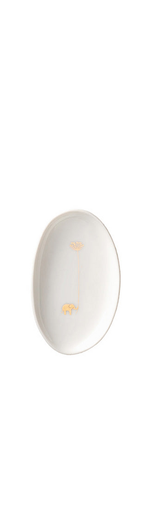 White oval plate with gold accents on a white background