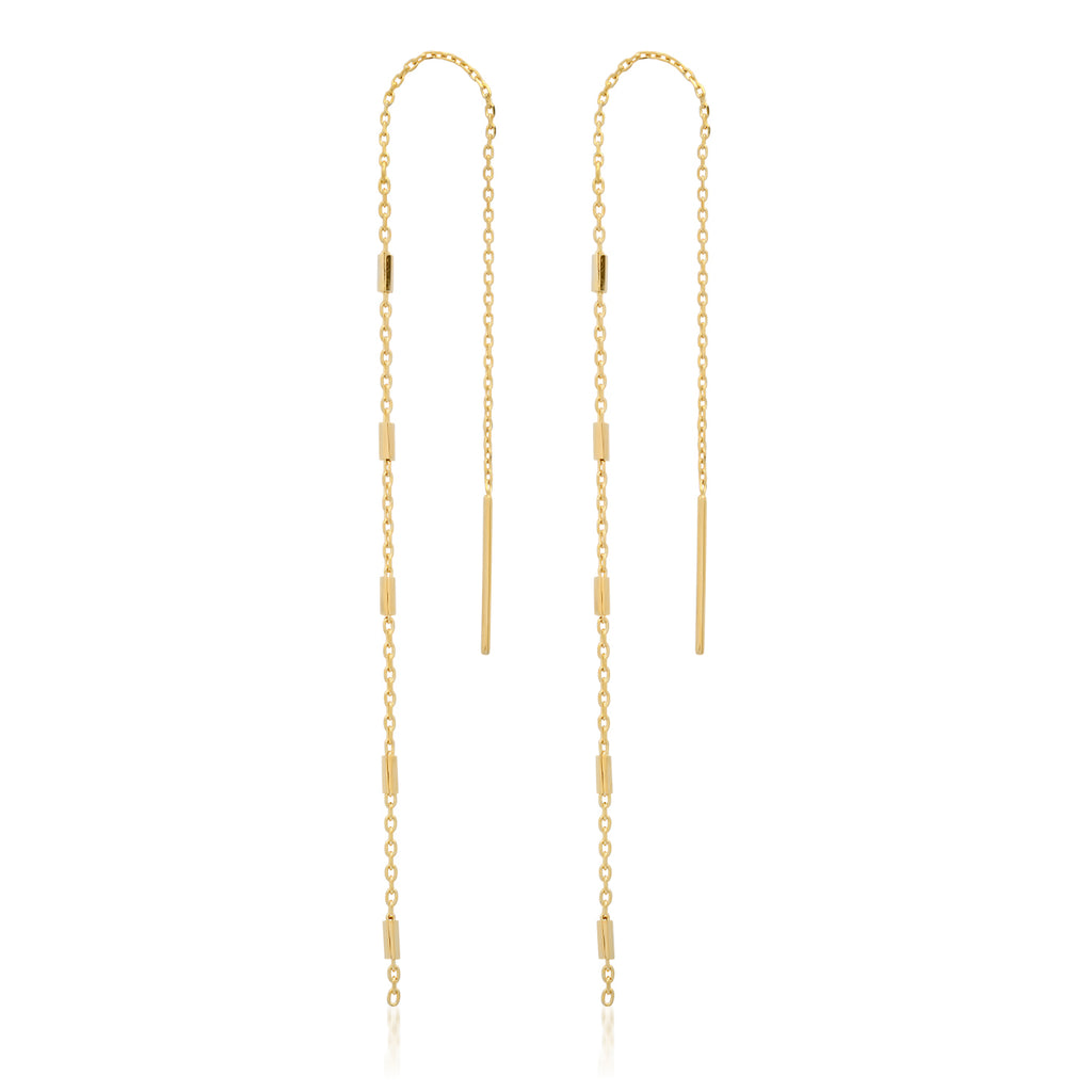 Gold chain earrings on a white background