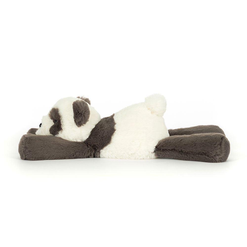 floppy grey and white plush panda lying down side view