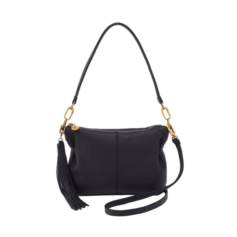Black handbag with a gold links and tassel on a white background