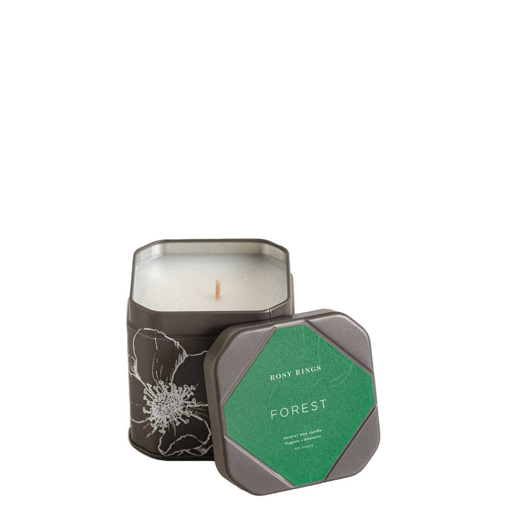 Candle in a tin with 'Forest' label on a white background