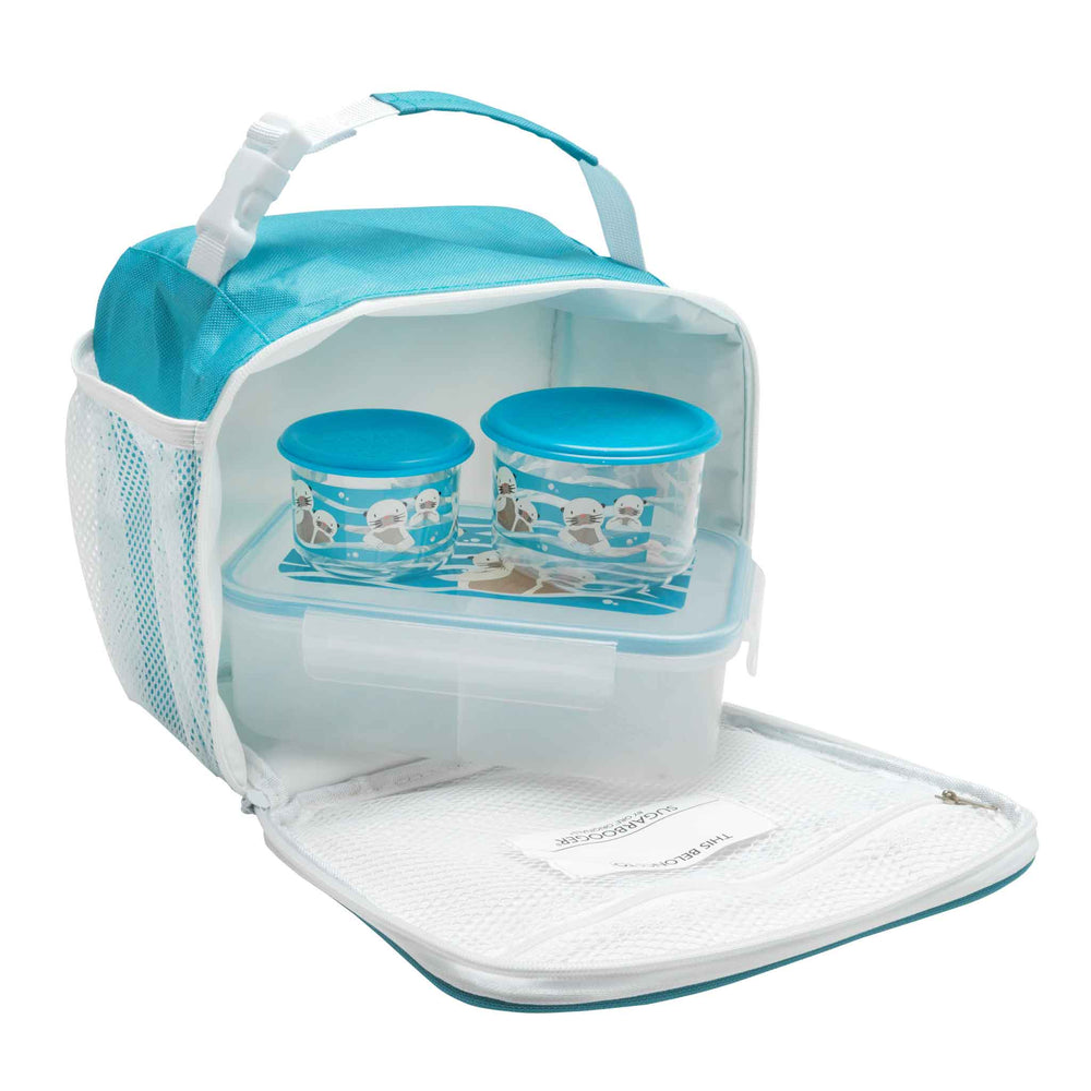 Lunch tote open with otter containers a snack box inside on white background