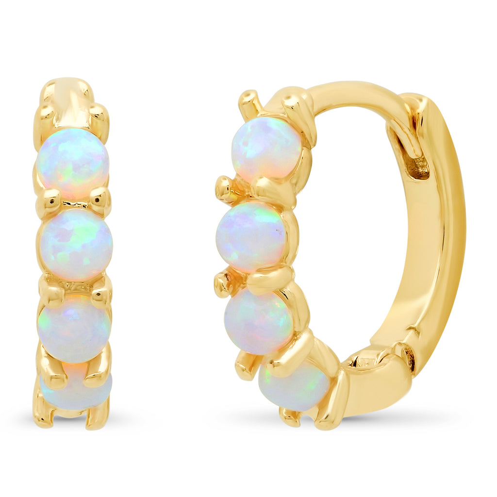 Gold hoop earrings with opal stones on a white background
