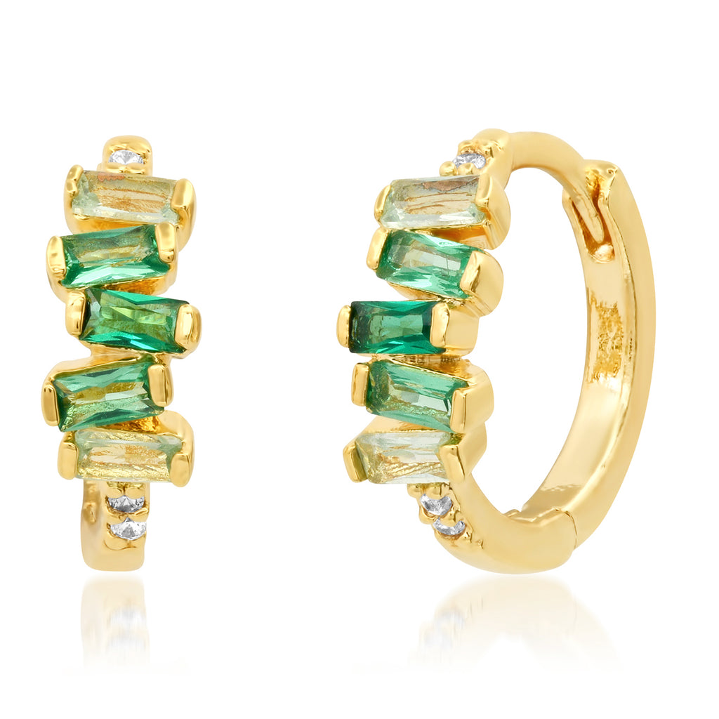 Gold hoop earrings with green gemstones on a white background