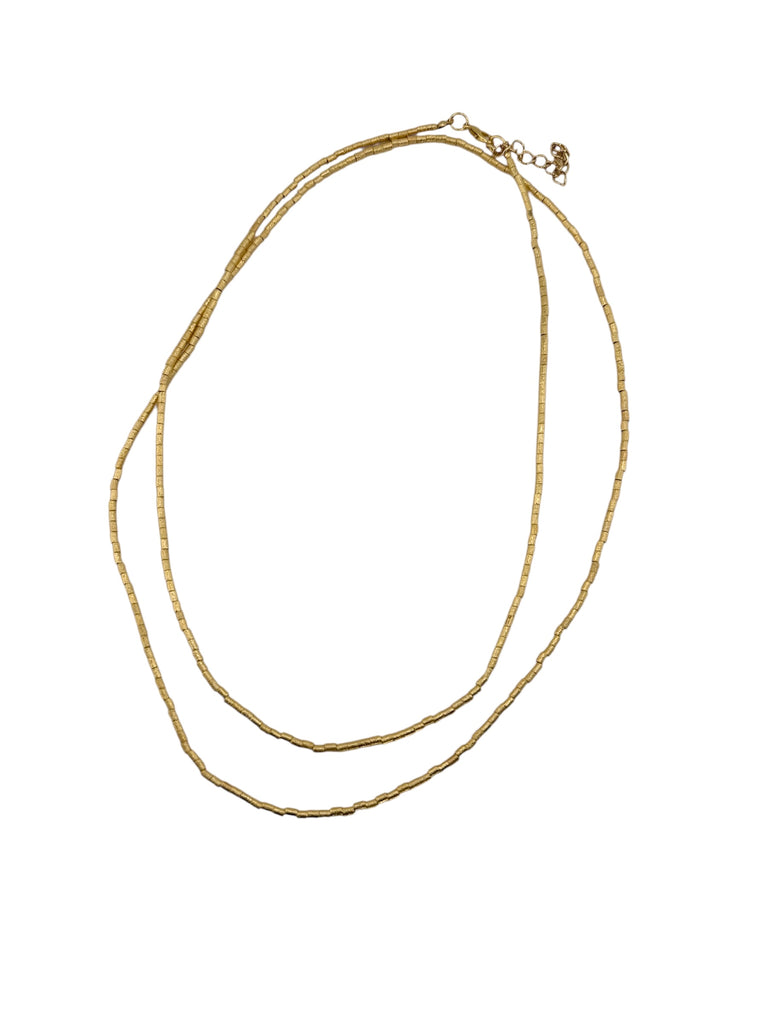 Gold necklace on a white background