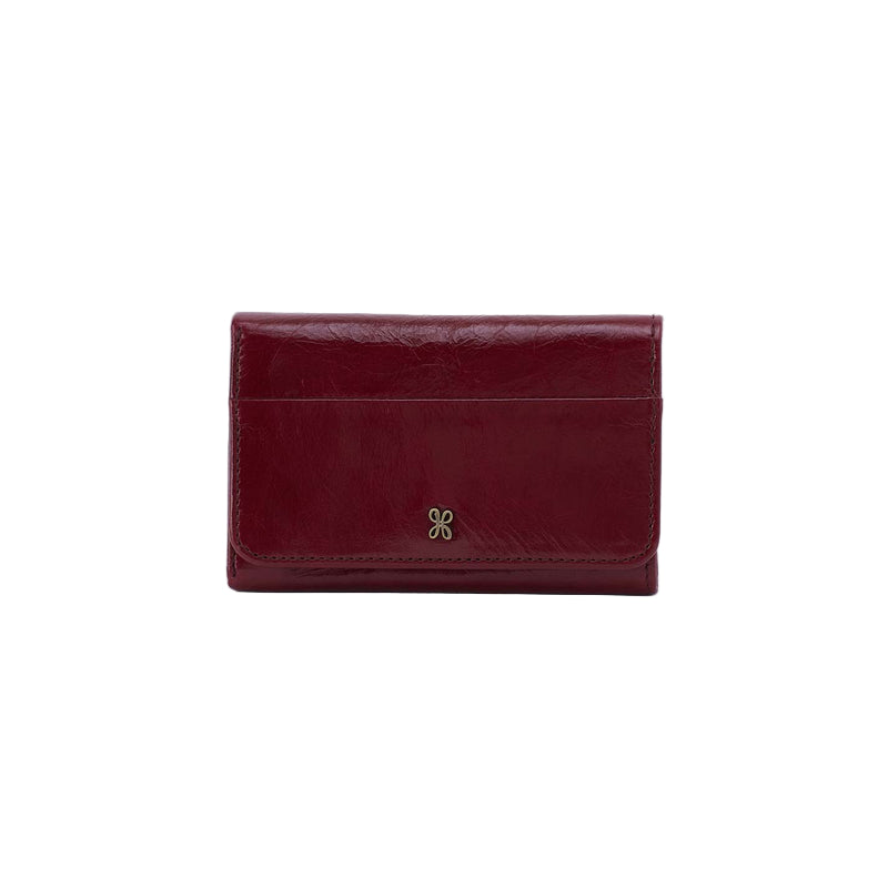 Red leather wallet with a gold emblem on a white background