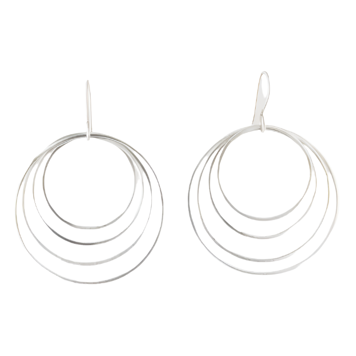 A pair of sterling silver hoop earrings with graduated circles of hammered wire design, displayed against a white background.