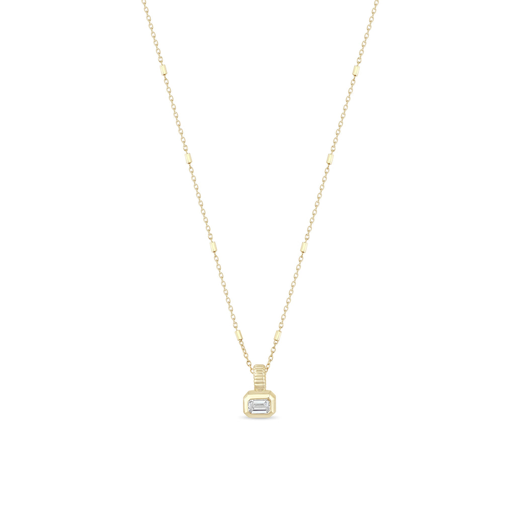 Gold necklace with a pendant on a white background
