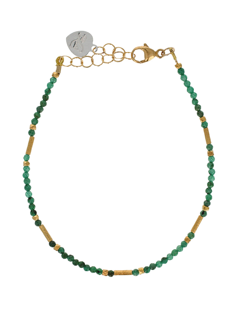 Green beaded bracelet with gold accents on a white background