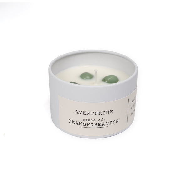 white candle tin with adventurine on white background