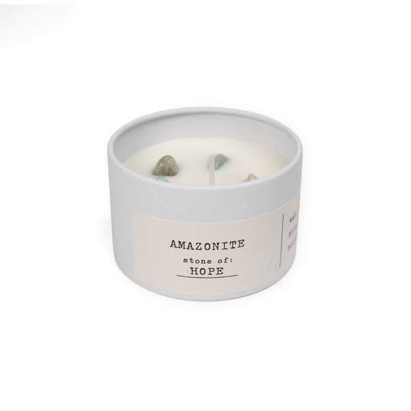 Candle in a white container with 'Amazonite stone of hope' text on a white background