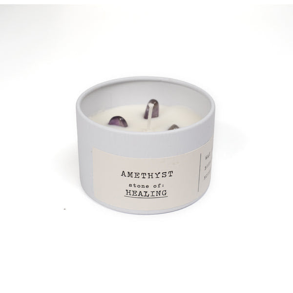 white candle tin with amethyst on white background