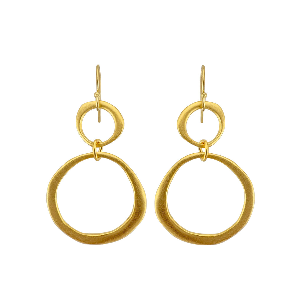 Gold hoop earrings on a white background