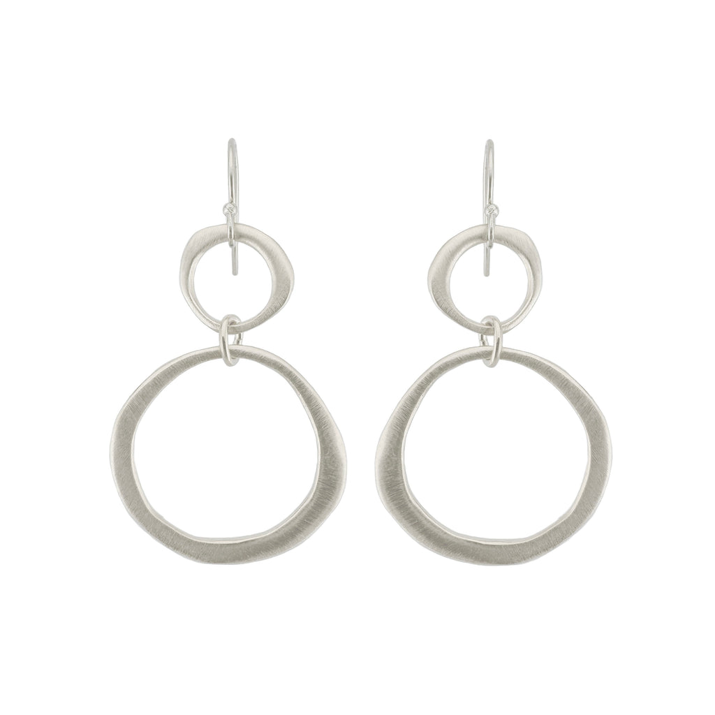 Pair of silver hoop earrings on a white background