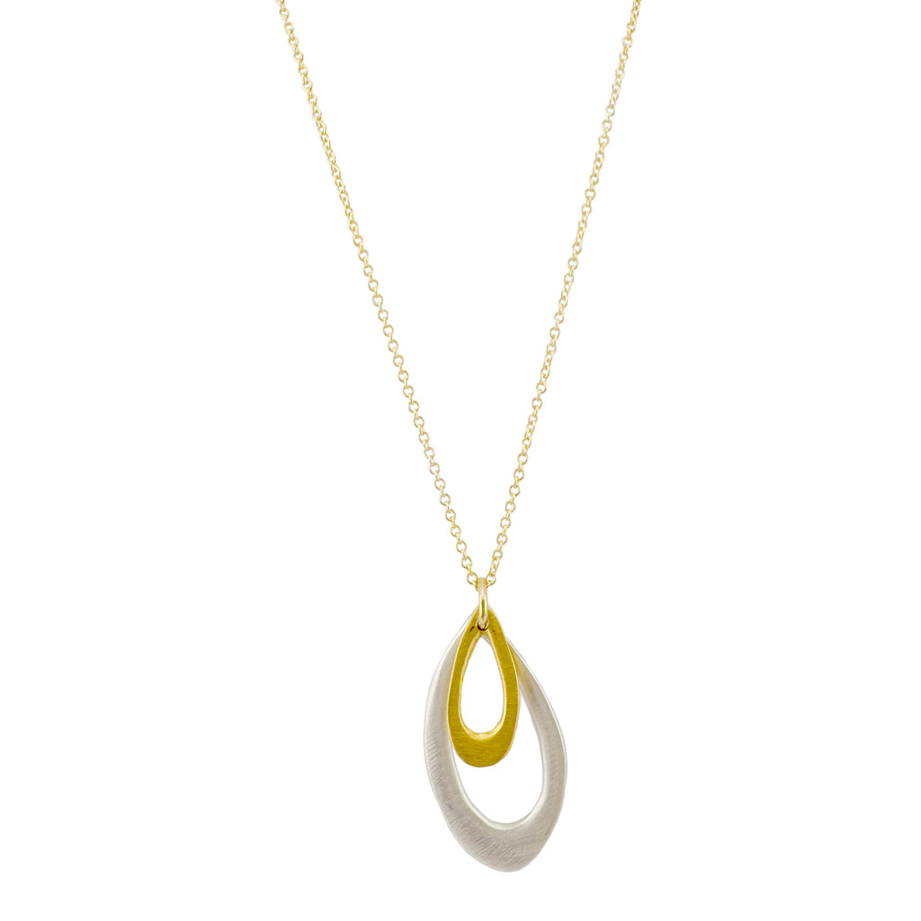 Necklace with a gold and silver pendant on a white background